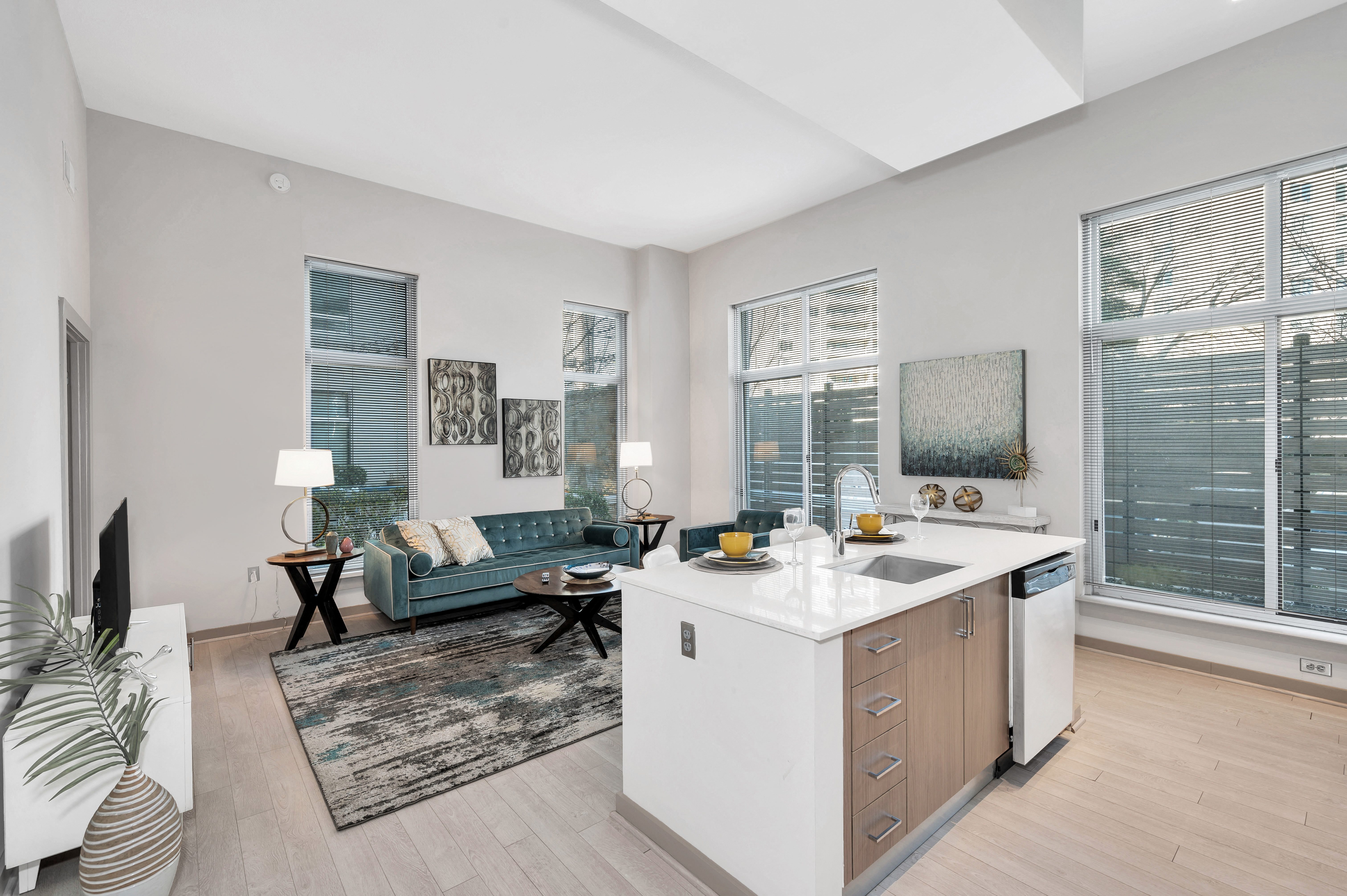 Kitchen island with built-in sink and Italian cabinetry in select apartment homes Kitchen island with built-in sink and Italian cabinetry in select apartment homes